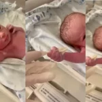 Funny reactions as newborn baby holds doctor’s hand and refuses to let go (Video)